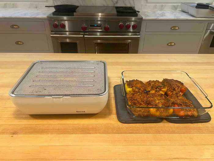 Host Modern baking dish set on a candlelit dining table, food still steaming
